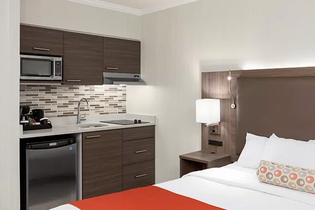 Fully equipped kitchenette with induction stove at Downtown Vancouver GEC Granville Suites long term extended stays hotel