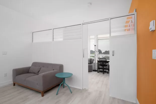 Sectioned Private Bedroom at GEC Burnaby Heights student residence in greater Vancouver features one twin bed for 1 students in a shared apartment