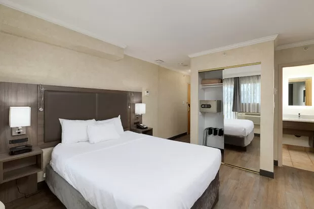 Downtown Vancouver GEC Granville Suites long term extended stays hotel premium furnished rooms with queen bed