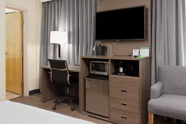 Downtown Vancouver GEC Granville Suites long term extended stays hotel premium furnished rooms with flat screen TV, desk, chair, mini fridge, and microwave